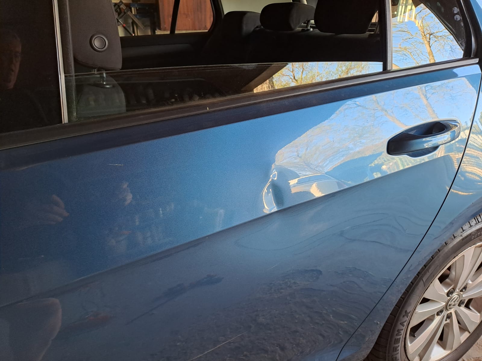 Dent on the bodyline of the rear door pannel